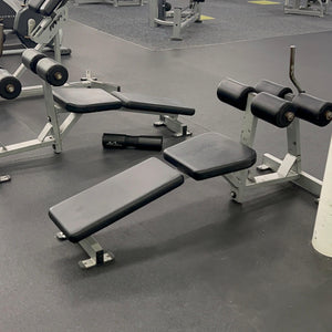 Gym equipment including weight benches and dumbbells with 'GetFit' branding in the background.
